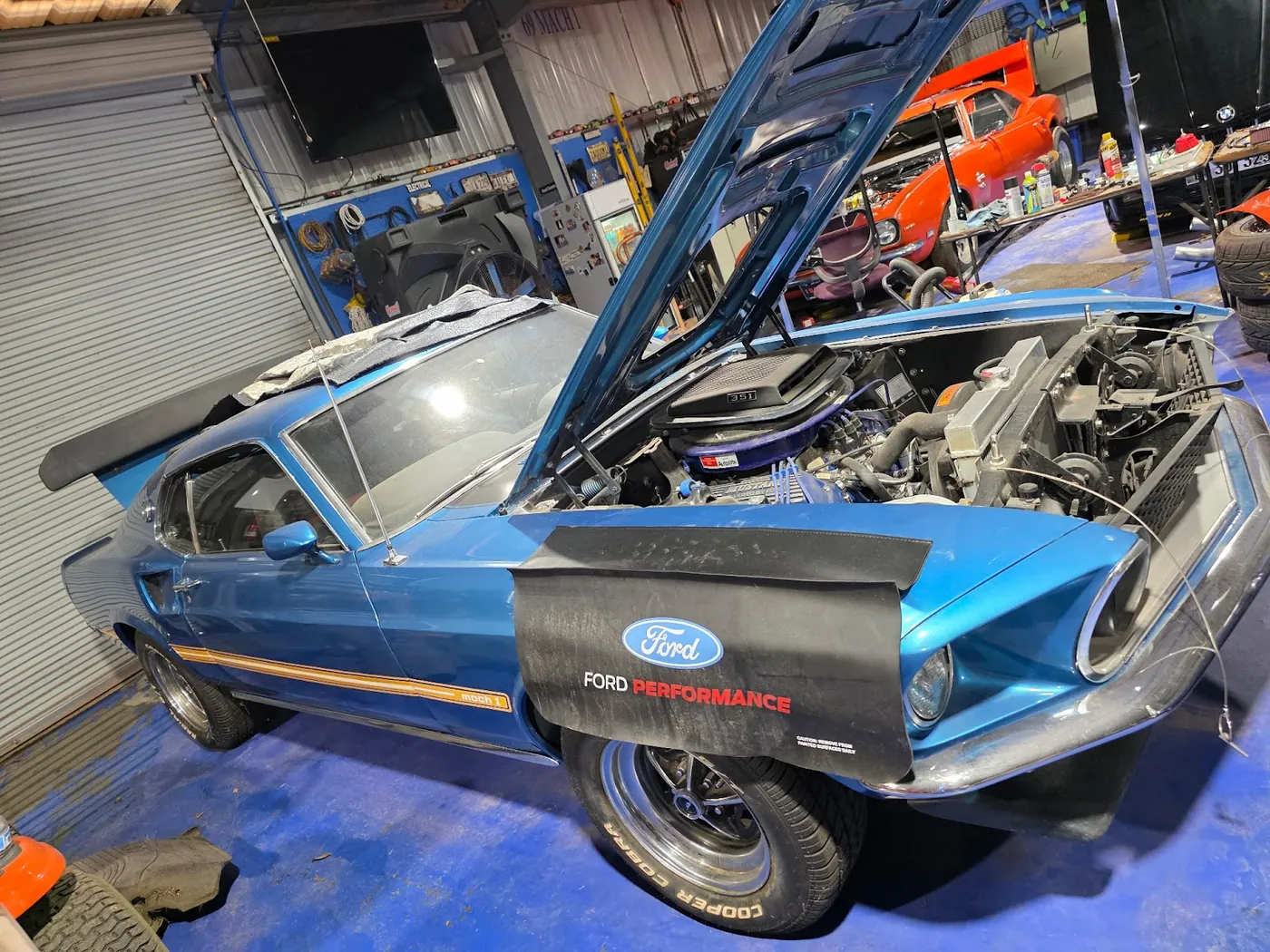 Classic Ford Mustang Mach 1 in the Gibby's Towing shop in Mobile, AL — the same care we give classic, luxury and everyday vehicles across Saraland, Theodore, Prichard and Semmes